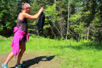 Standing up tripod with 15 liter solar shower bag.